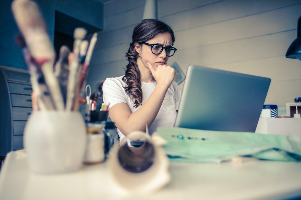 Female entrepreneur doing research on her computer