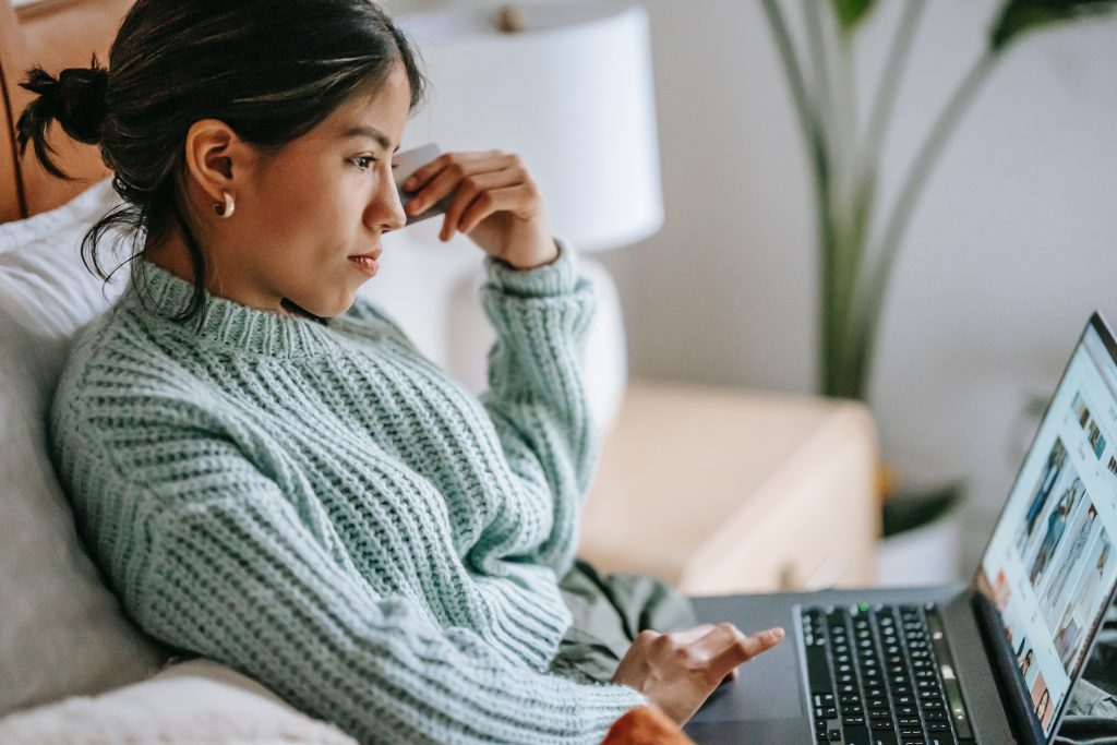 Financial Independence - Woman paying her credit card bill online